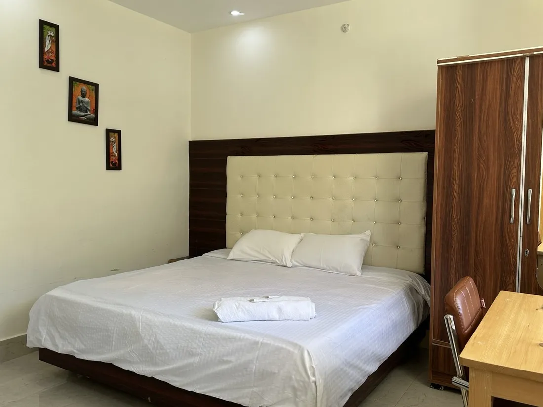 Standard room with window desk and forest view